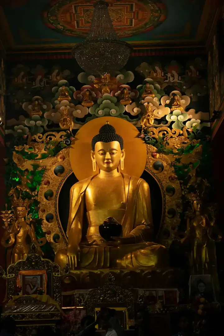 A serene Buddha statue in soft light